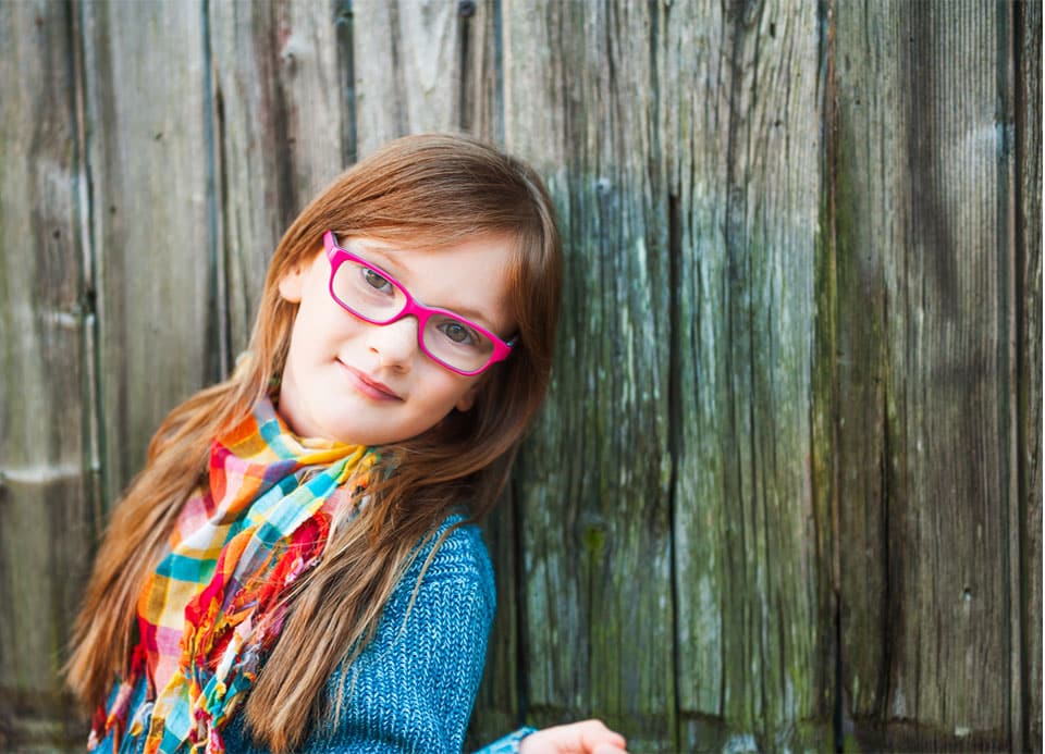 A girl wearing children's glasses
