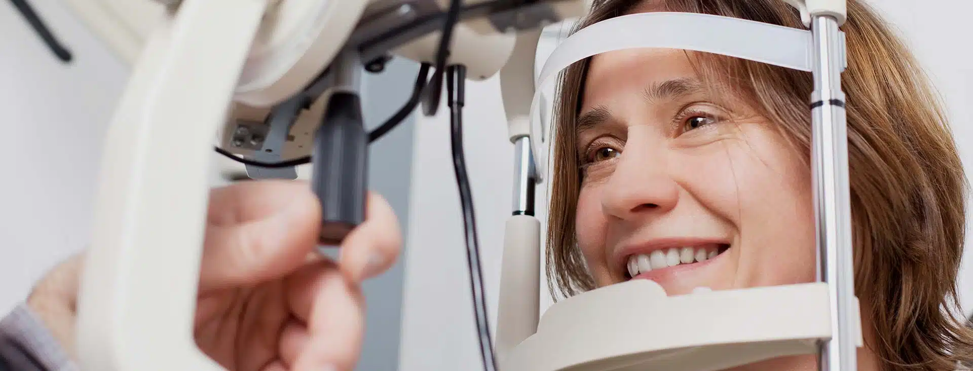 A woman receives an eye exam