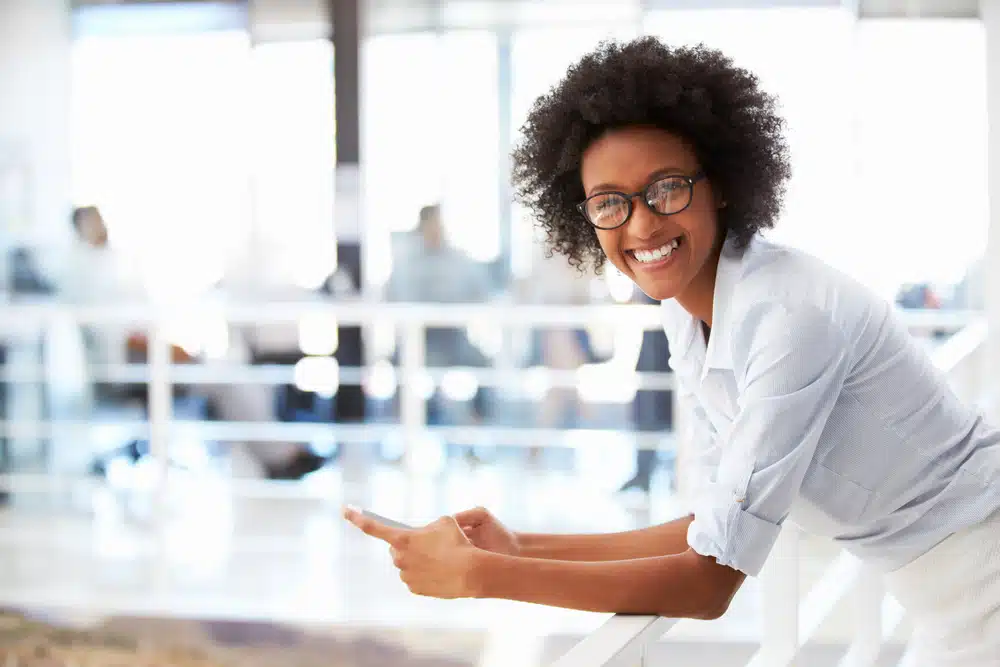 woman smiling in new eyeglasses