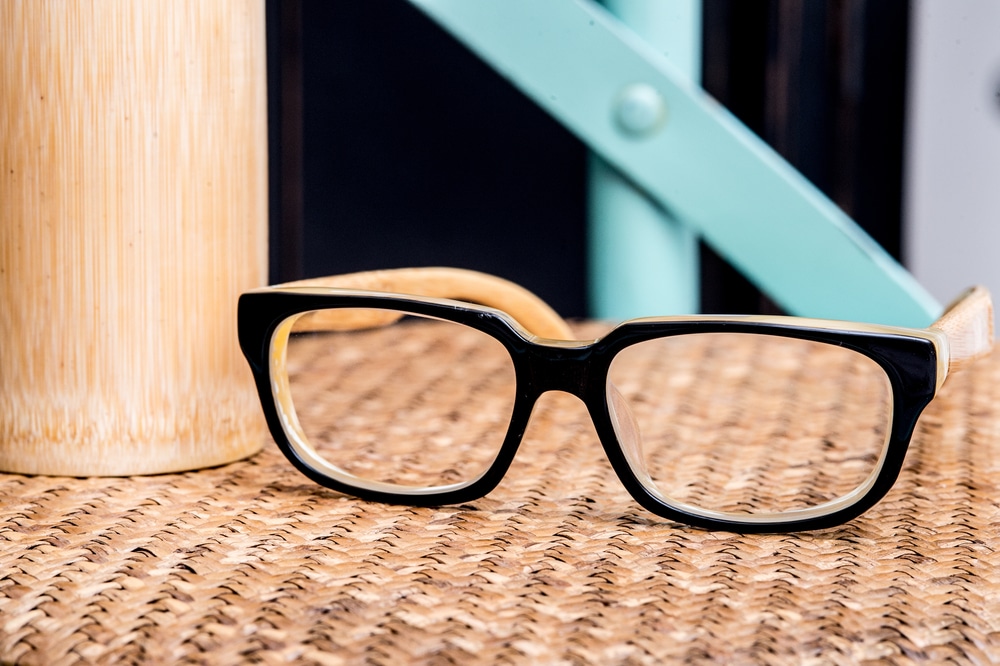 new eye glasses in a wicker chair