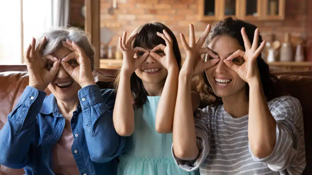 Portrait,Of,Overjoyed,Three,Generations,Of,Latino,Women,Make,Glasses