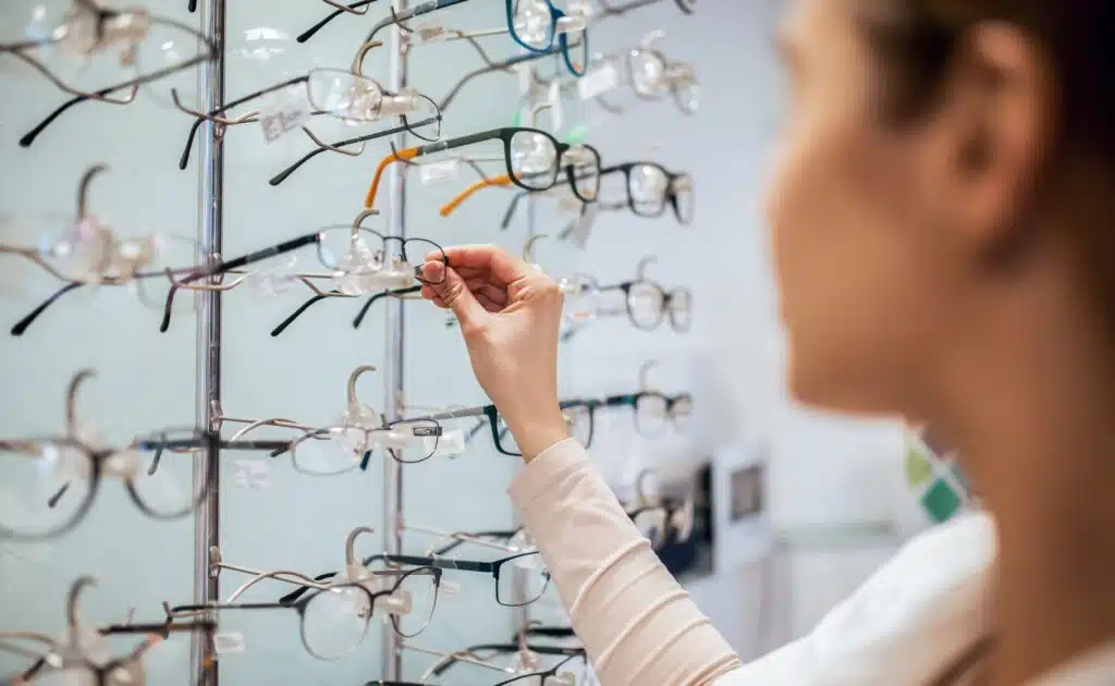 Need,A,New,Glasses.,Woman,In,Optic,Store,Choosing,A